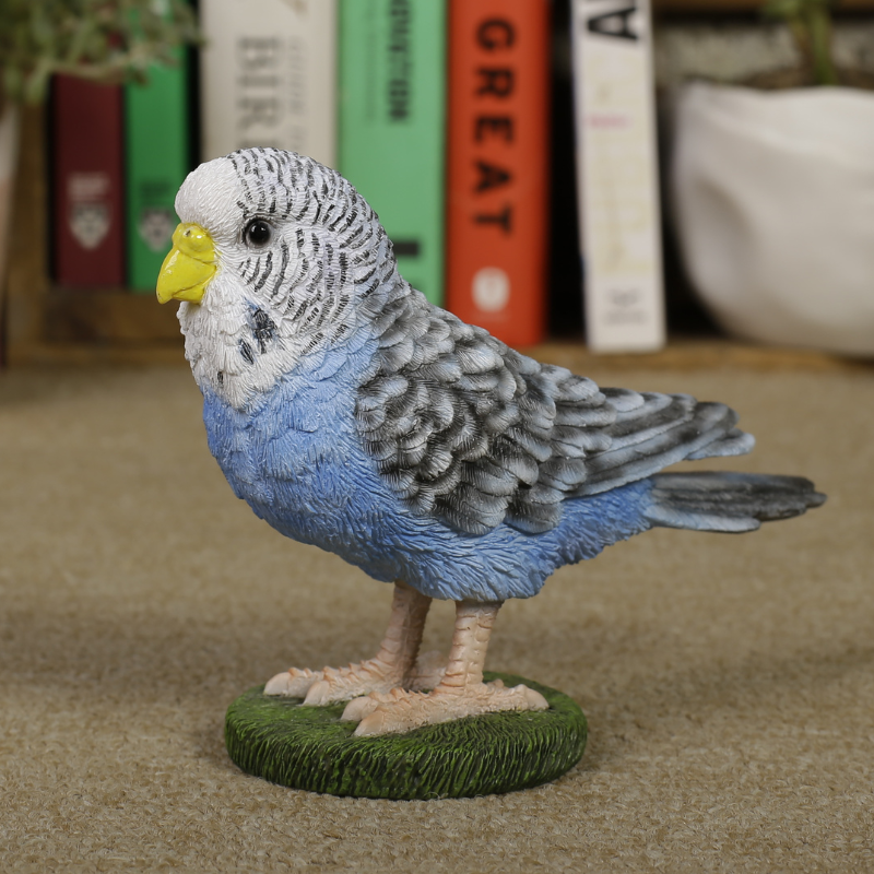 揺れる青いセキセイインコ