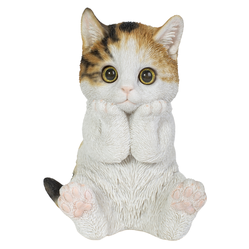 頬杖をつく三毛猫