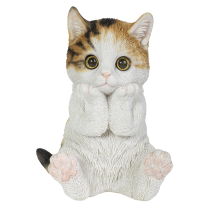 頬杖をつく三毛猫