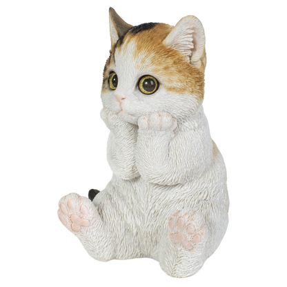頬杖をつく三毛猫